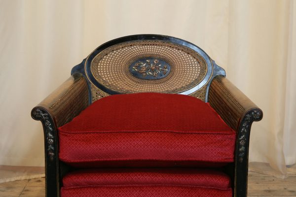 A 1920s Louis XVI Style Ebonised Bergere Armchair