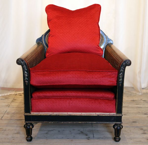 A 1920s Louis XVI Style Ebonised Bergere Armchair