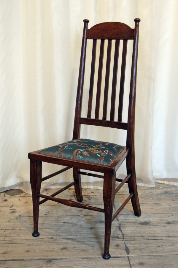 A High backed arts & crafts side chair in embroidered silk