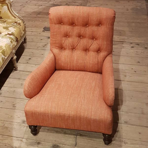 This is a nicely sized, comfortable Edwardian button back armchair, which has been completely restored traditionally, re-webbed, re-sprung & reupholstered. The frame is very heavy and well-constructed, with traditionally sprung seat. The armchair has been re-covered in a printed English linen by Fermoie fabric