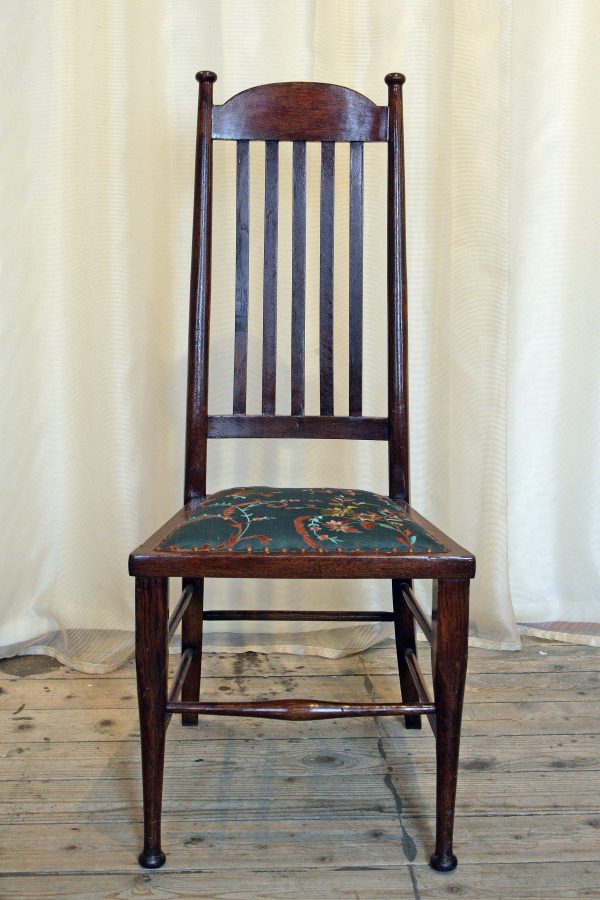 A High backed arts & crafts side chair in embroidered silk