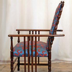 An Arts & Crafts Oak Reclining Armchair retailed by Wylie & Lochhead Glasgow