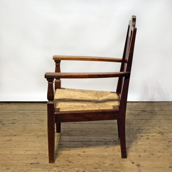 An Arts & Crafts Armchair by Sir Frank Brangwyn