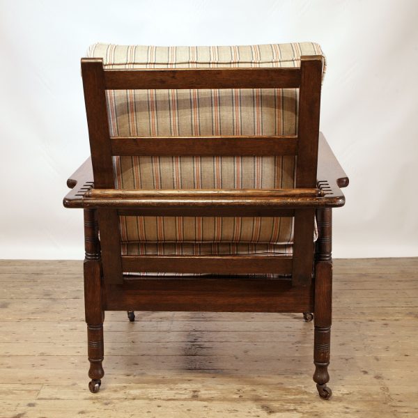 An Oak Reclining Armchair by James Shoolbred & Company London