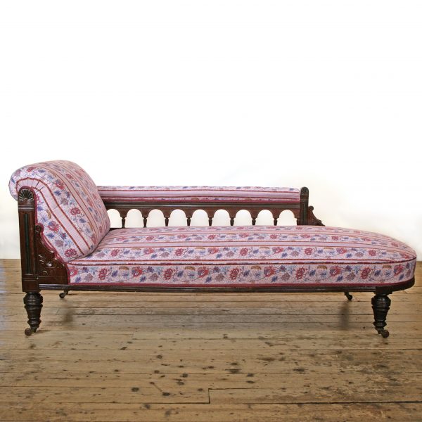 An Aesthetic Movement Chaise Longue possibly by Lamb of Manchester upholstered in Quenin fabric