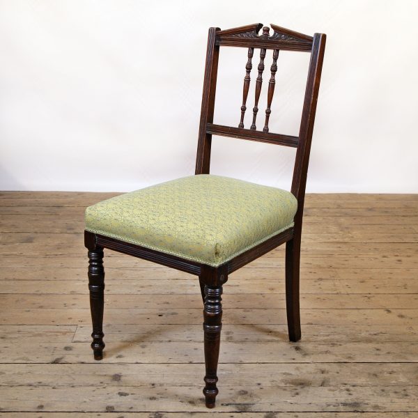 Refined occasional chair reupholstered in a Jean-Paul Gaultier Fabric.