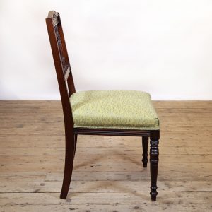 Refined occasional chair reupholstered in a Jean-Paul Gaultier Fabric.