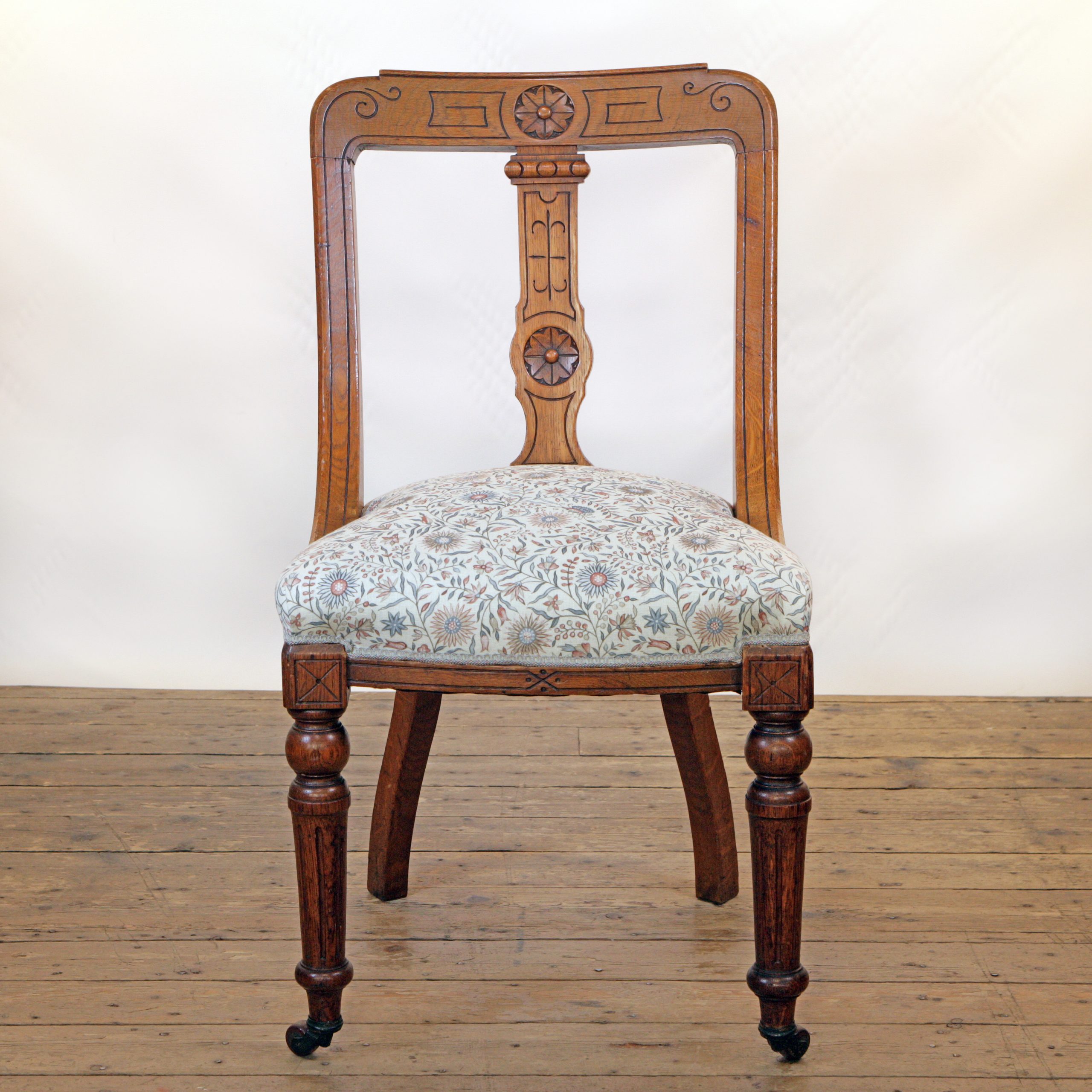 An Oak side chair in Lewis and Wood linen