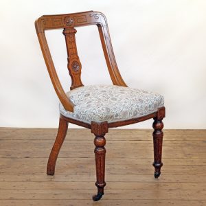 An Oak side chair in Lewis and Wood linen