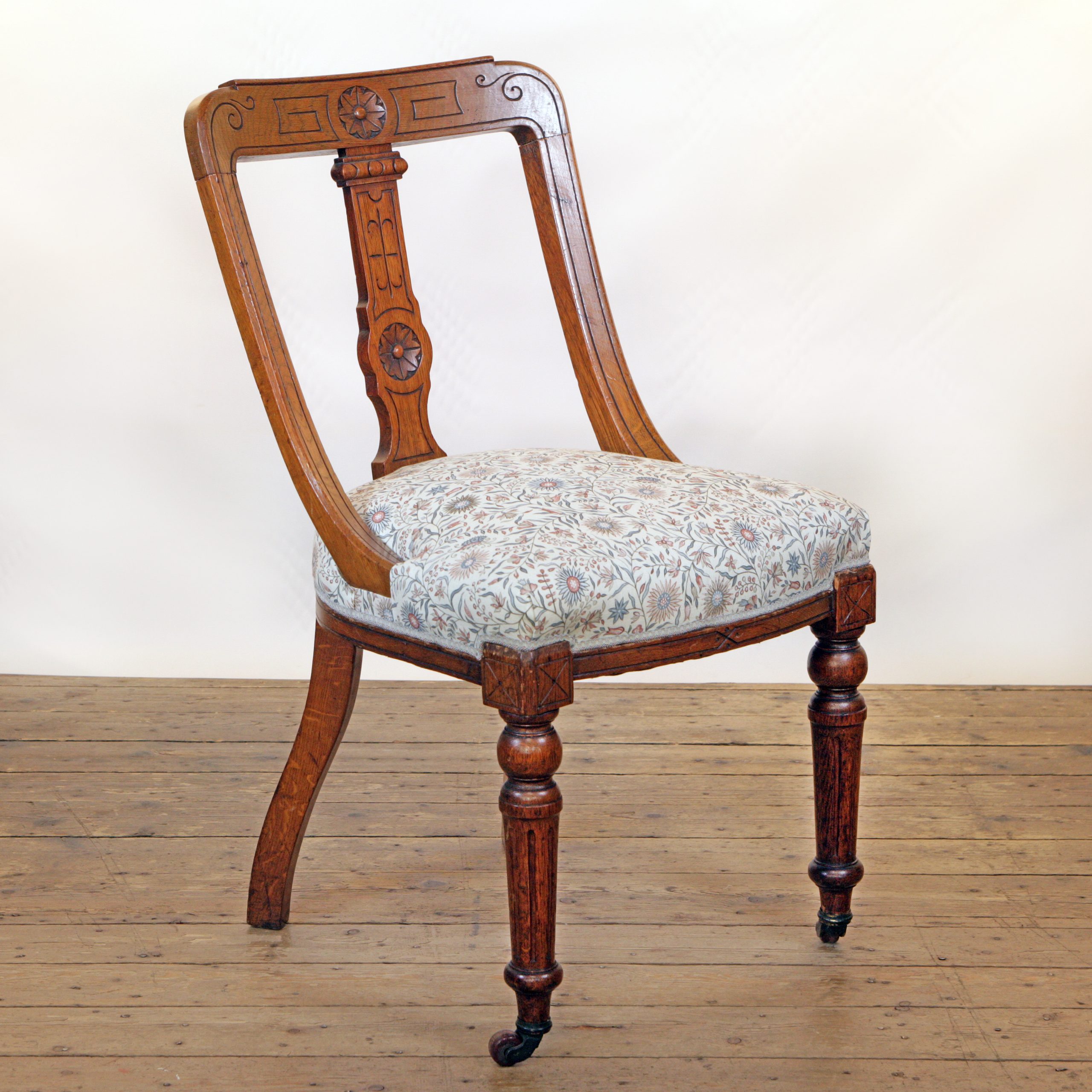 An Oak side chair in Lewis and Wood linen