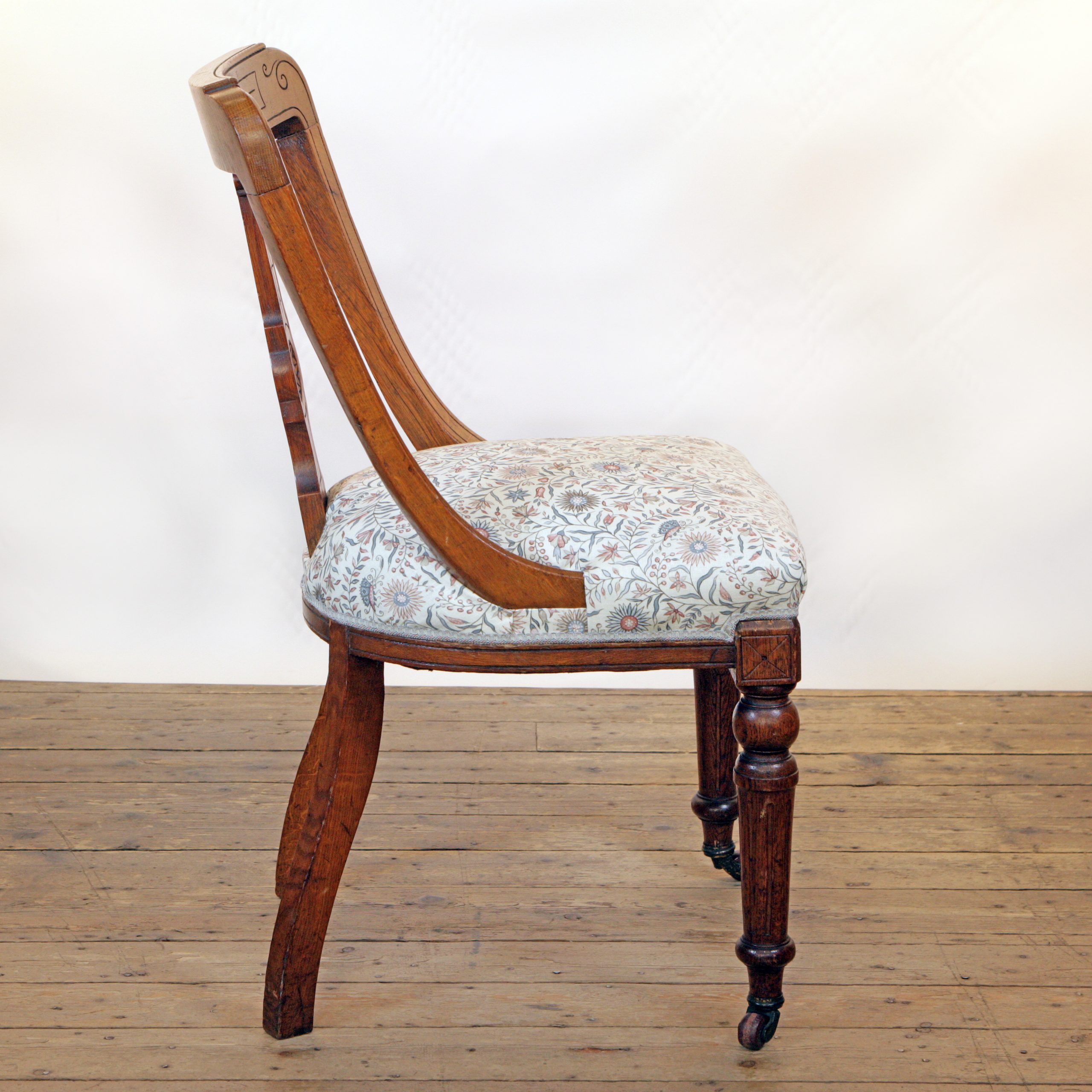 An Oak side chair in Lewis and Wood linen