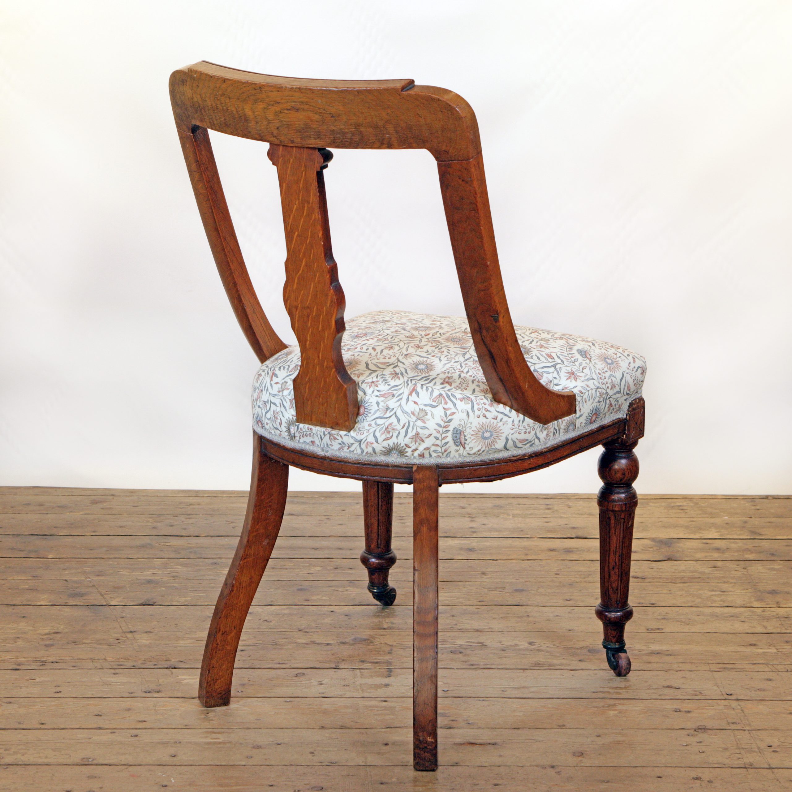 An Oak side chair in Lewis and Wood linen