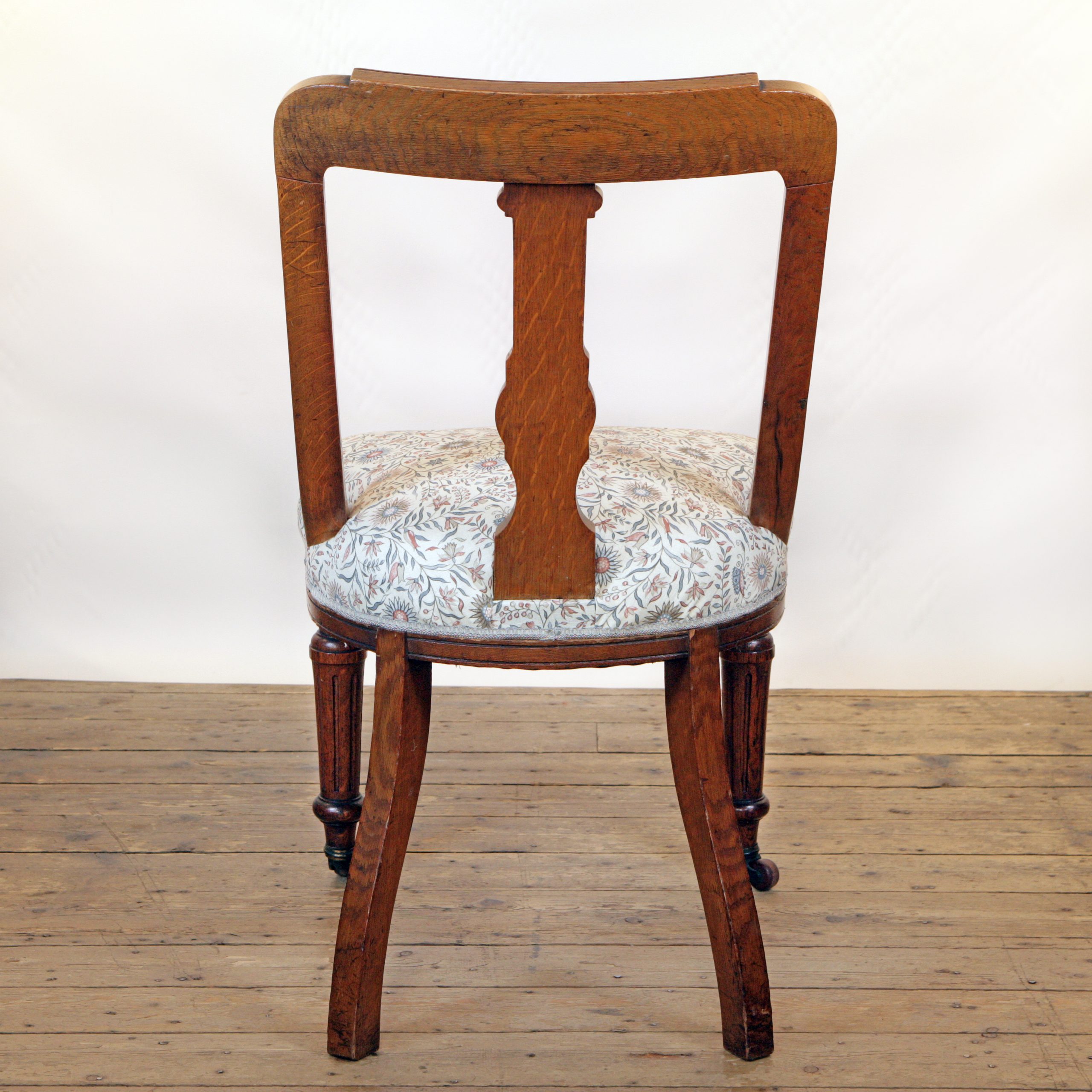 An Oak side chair in Lewis and Wood linen