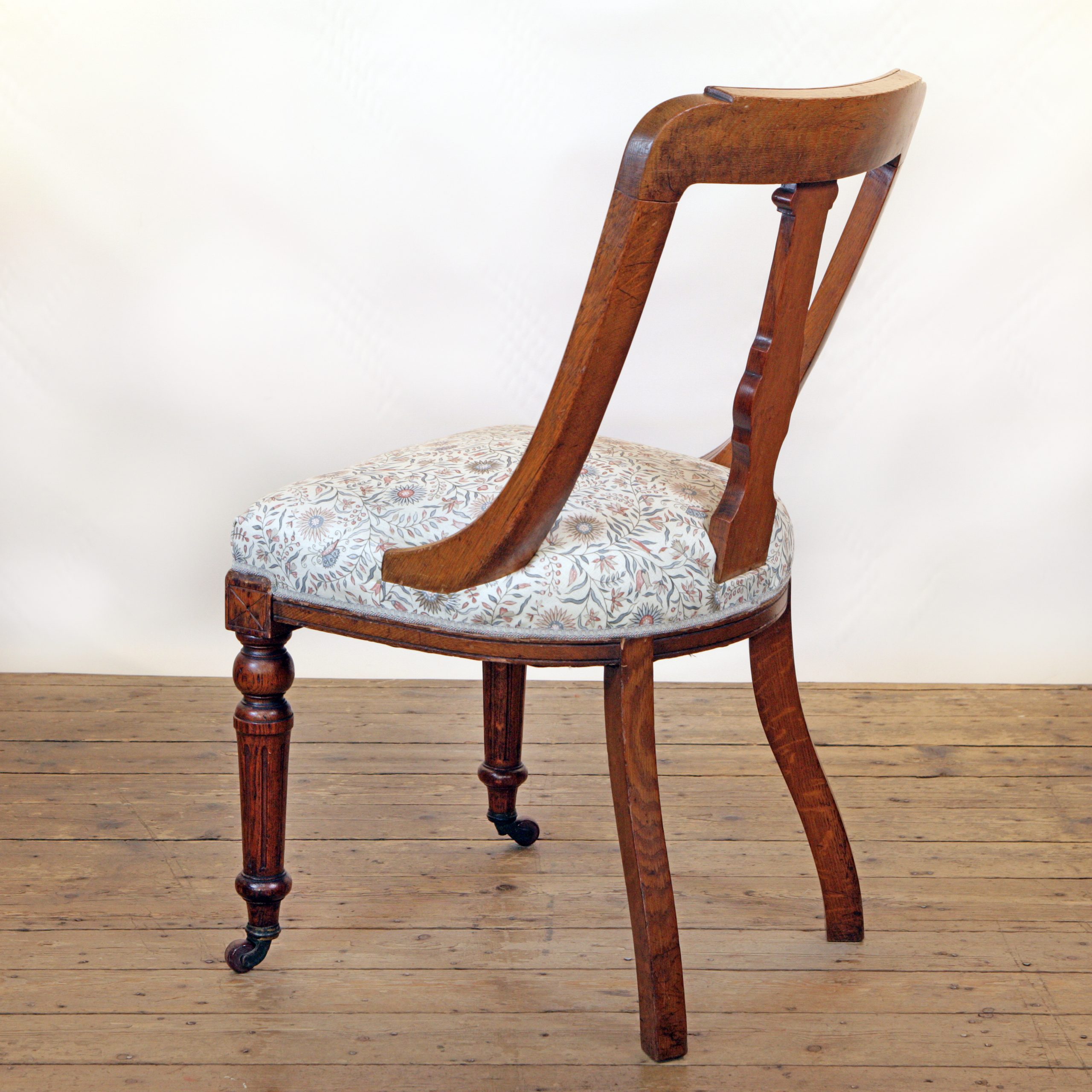 An Oak side chair in Lewis and Wood linen